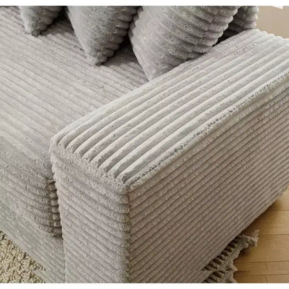 Divano sezionale a L rivestito in velluto a coste Isabel 111" con 8 cuscini